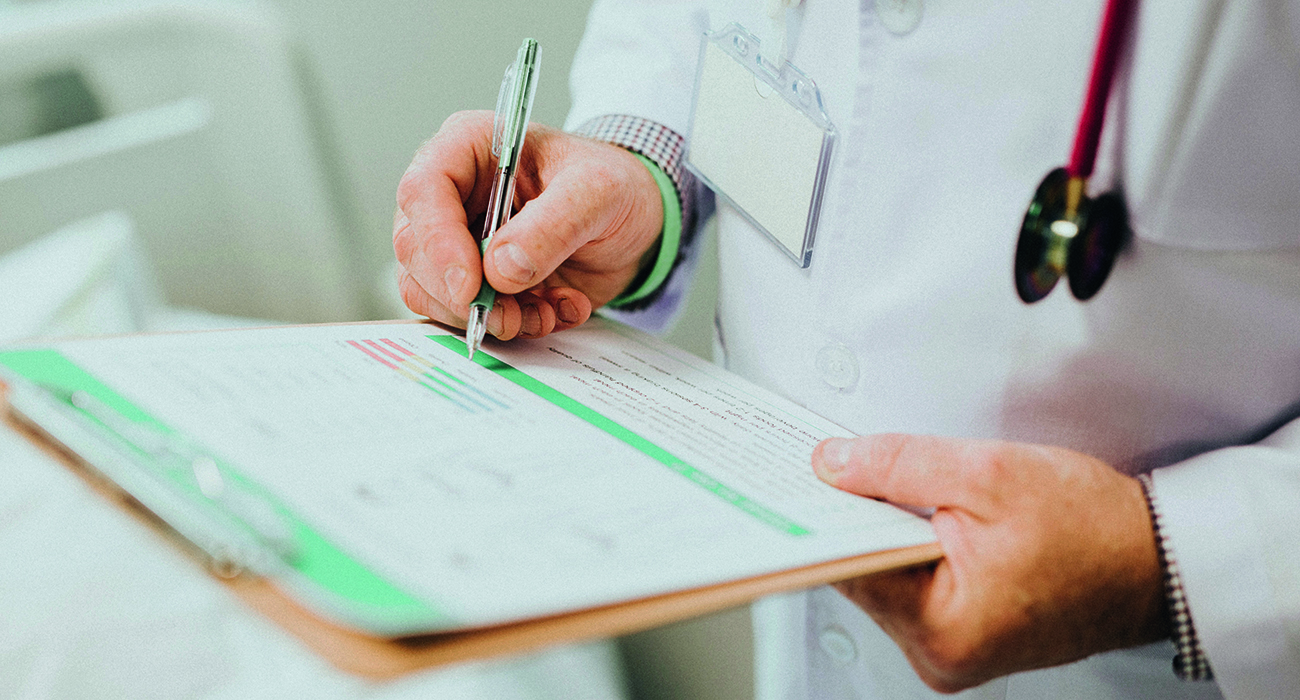 Doctor in white shirt with a clipboard diagnosing Legionnaires' disease