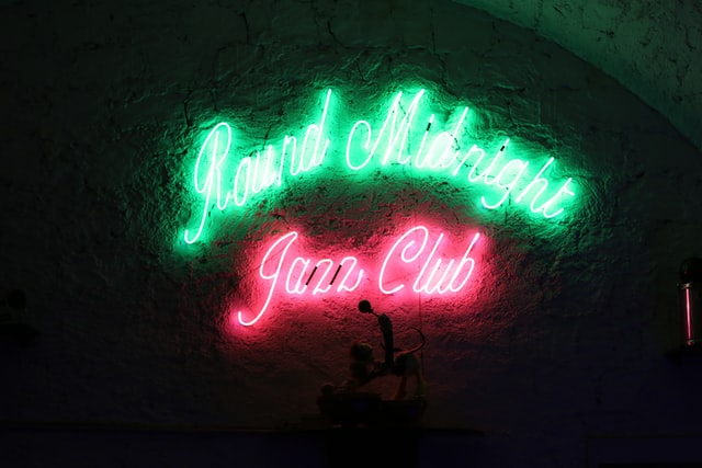 Neon sign reading 'jazz club' celebrating Jazz Appreciation Month